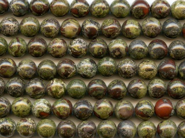 Put mystical color into your designs with the dragon blood jasper 8mm round beads from Dakota Stones. These round beads feature deep forest green color with splatters of crimson red. The two primary colors contrast and complement each other to form a striking jasper. This gemstone is mined in Australia. Dragon blood jasper is part of the quartz family. Metaphysical Properties: Dragon blood jasper enhances courage, strength and vitality.Because gemstones are natural materials, appearances may vary from bead to bead. Each strand includes approximately 24 beads. 