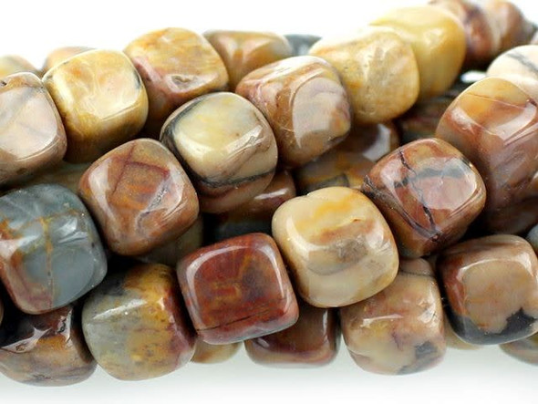 Add contemporary flair to designs with the Dakota Stones 7mm Venus Jasper cube beads. These beads feature a modern cube shape. Use them in contemporary designs for a splash of color. They are versatile in size, so you can use them in necklaces, bracelets and even earrings. These gemstone beads feature warm, earthy tones like beige, peach, brown and gray. They are sure to add soothing style to your designs. Venus Jasper takes its name from the planet Venus, which was named for the Roman goddess of love and beauty. It is also referred to as orbicular rhyolite. Metaphysical Properties: Jasper is a stone used from grounding, stability, strength and healing.Because gemstones are natural materials, appearances may vary from piece to piece. Each strand includes approximately 28 beads.