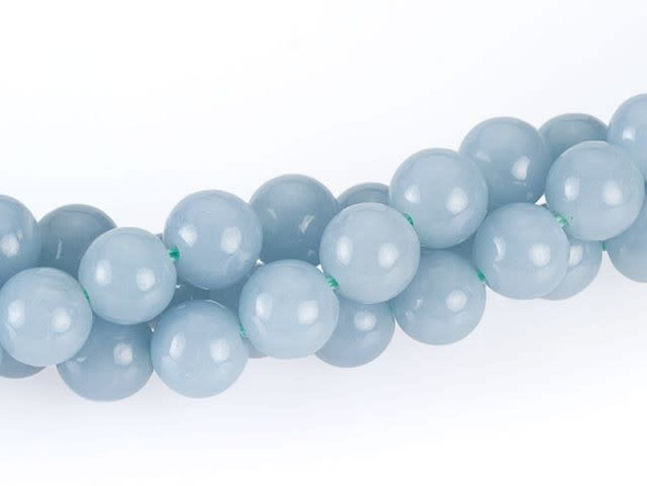 Heavenly style fills the Dakota Stones 6mm angelite round beads. These beads are perfectly round in shape, so use them in classic designs. They are versatile in size, so they are excellent choices for necklaces, bracelets and even earrings. They display a soft sky blue color with a milky quality.Because gemstones are natural materials, appearances may vary from piece to piece. Each strand includes approximately 34 beads. 
