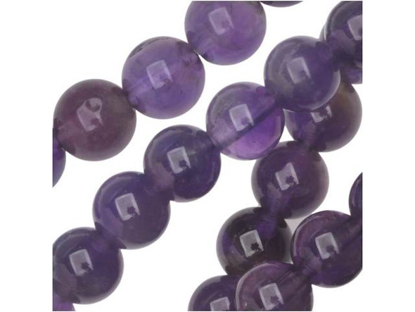 Add the sophistication of natural beauty to your looks with the Dakota Stones amethyst 6mm round beads. Available by the strand, these beads are spherical in shape and are full of deep purple color, accented with the occasional streak of cloudy white. These beads feature a versatile size that can be used in necklaces, earrings and bracelets. Amethyst is the official birthstone of February. It forms in silica-rich liquids deposited in geodes and is generally found in clusters of crystal points. Metaphysical Properties: This stone's name is derived from the Greek word amethystos, meaning "not drunken." People of ancient times believed it to protect the wearer from drunkenness. Today, this gemstone is believed to promote happiness.Because gemstones are natural materials, appearances may vary from piece to piece. Each strand includes approximately 34 beads. Our amethyst beads have nice, deep color, but may show natural inclusions.