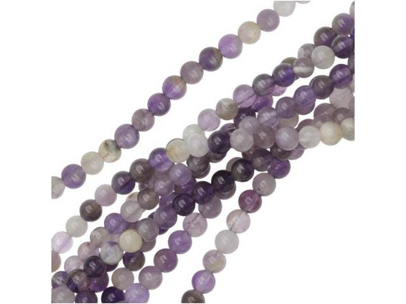 Add small spots of sweet purple color to your designs. These beads feature varying shades of purple mixed with cloudy white. These beads are perfectly round and very small. Use these small beads as spacers between larger components. Mined in Africa, dog teeth amethyst is a combination of amethyst and white quartz mixed together in a striped, chevron pattern. It is named for its resemblance to the dog tooth violet. This stone is also known as chevron amethyst. Metaphysical Properties: Dog teeth amethyst is said to help remove resistance to change and to dissipate and repel negativity of all kinds.Because gemstones are natural materials, appearances may vary from bead to bead. Each strand includes approximately 52 beads. Our amethyst beads have nice, deep color, but may show natural inclusions.