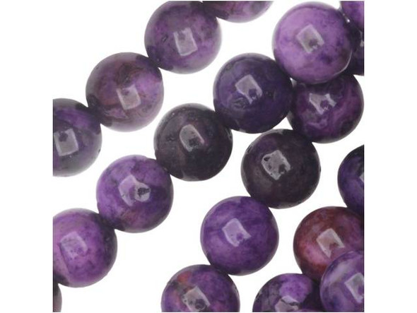 Like melting ice cream, these purple crazy lace agate 6mm round beads from Dakota Stones are swirling with color. These round beads will add rich color to your necklace and bracelet designs. The purple color is swirled with burgundy and black. They have a Mohs hardness of 6.5-7. Mexican crazy lace agate is normally an opaque white gemstone with swirling patterns, but these beads are color enhanced to emphasize these beautiful patterns. Color enhancing is common amongst agates to make them fashionably relevant. Metaphysical Properties: Often called the happy stone, crazy lace agate promotes laughter and optimism. Because gemstones are natural materials, appearances may vary from bead to bead. Each strand includes approximately 34 beads.