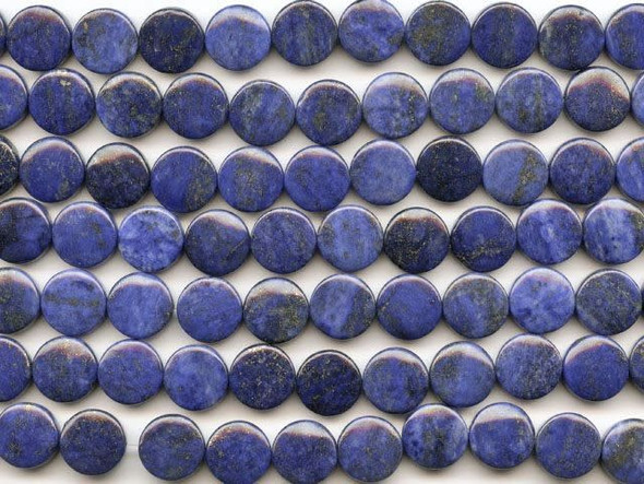 Flecks of gold color decorate the deep blue lapis lazuli 12mm coin beads from Dakota Stones. These coin-shaped beads feature deep blue color flecked with shimmering golden sparkles. Lapis lazuli is a semi-precious stone that contains primarily lazurite, calcite and pyrite. It was among the first gemstones to be worn as jewelry and worked on. Metaphysical Properties: Lapis lazuli is said to enhance insight, intellect and awareness.Because gemstones are natural materials, appearances may vary from bead to bead. Each strand includes approximately 16 beads.
