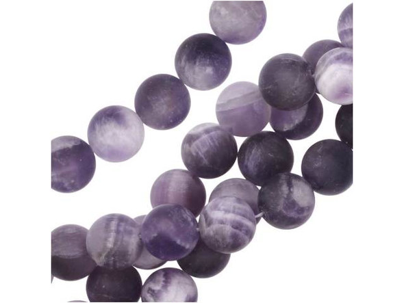 An elegant display fills these Dakota Stones dog teeth amethyst beads. These gemstone beauties are perfectly round in shape and bold in size, so they will stand out in necklaces, bracelets, and earrings. Dog teeth amethyst is a combination of amethyst and white quartz mixed together in a striped, chevron pattern. These beads have a matte finish, for a soft appearance. It is named for its resemblance to the dog tooth violet. This stone is also known as chevron amethyst. Metaphysical Properties: Dog teeth amethyst is said to help remove resistance to change and to dissipate and repel negativity of all kinds.Because gemstones are natural materials, appearances may vary from bead to bead. Each strand includes approximately 20 beads. Our amethyst beads have nice, deep color, but may show natural inclusions.