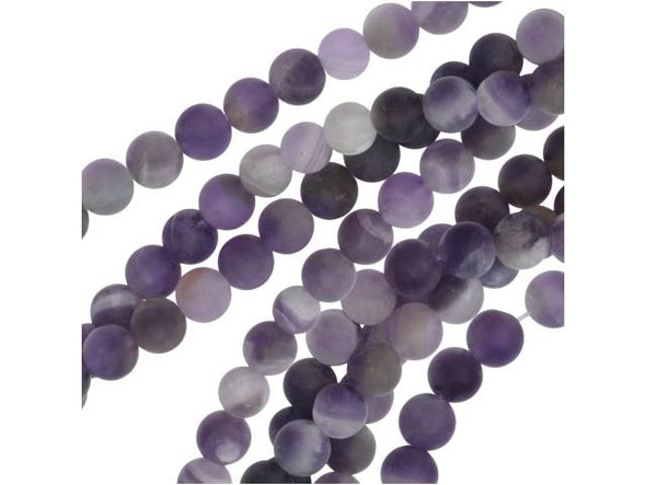 Elevate your DIY jewelry creations with these Dakota Stones Matte Dog Teeth Amethyst gemstone beads. Featuring a striking combination of deep and light purple hues mixed with white inclusions, each bead boasts the unique chevron pattern resembling the dog tooth violet. With their versatile 6mm round shape and unpolished matte finish, these beads are perfect for a variety of projects, from necklaces to bracelets and earrings. In addition to their aesthetic appeal, these gemstones are also believed to offer metaphysical properties that help eliminate resistance to change and ward off negativity. Each strand includes approximately 34 beads, with natural variations in appearance and color that add to their unique character. Upgrade your jewelry designs with these stunning Dakota Stones beads today.