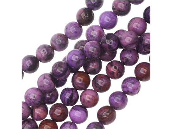 Simple, classic shape combines with rich, royal color in the purple crazy lace agate 8mm round beads from Dakota Stones. These beads would look beautiful with silk ribbon. The purple color is swirled with banded patterns of burgundy and black. They have a Mohs hardness of 6.5-7. Mexican crazy lace agate is normally an opaque white gemstone with swirling patterns, but these beads are color enhanced to emphasize these beautiful patterns. Color enhancing is common amongst agates to make them fashionably relevant. Metaphysical Properties: Often called the happy stone, crazy lace agate promotes laughter and optimism. Because gemstones are natural materials, appearances may vary from bead to bead. Each strand includes approximately 24 beads.