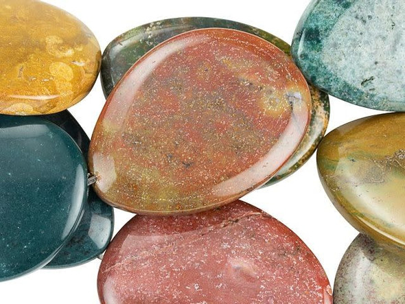 Bring bold elements to your designs with these Dakota Stones gemstone beads. Each bead features a unique oval shape that looks like a smooth river rock. Use these large beads as focal points in designs. You can string them onto head pins or wire wrap them. Named for the village near where it is found in Madagascar, Kabamby Ocean Jasper is known for its colors - dark green and mustardy yellow, with accents of pink, red, and white. You'll also love the beautiful patterns. Metaphysical Properties: Ocean Jasper is believed to be linked to the lost city of Atlantis and to hold mystic knowledge. Because gemstones are natural materials, appearances may vary from bead to bead. Each strand includes approximately 6 beads. 
