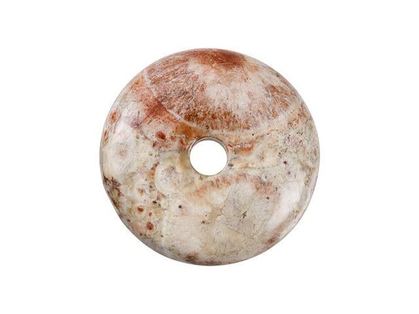 Stand out with gemstone style using this pendant from Dakota Stones. This birds eye rhyolite pendant features a round donut shape with a hole at the center. You can create your own unique bail for this pendant or simply slide a silk ribbon right through. There are lots of fun ways you can showcase this piece in your designs. This pendant features splotches of red, brown, and cream colors. Rhyolite was named "streaming rock" because of its beautiful bands, bubbles, and crystal-rich layers that form as lava flows onto the surface of the stone. Metaphysical Properties: Rhyolite shows us how to relish in the vast potential within ourselves. This is a stone used for meditation, progression in life, focusing on the present moment, and for resolving issues not yet complete.Because gemstones are natural materials, appearances may vary from piece to piece.Diameter 24.5mm, Opening Diameter 4mm