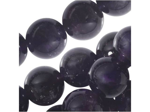 Create beautiful, high-quality designs with the Dakota Stones amethyst 10mm round beads. Available by the strand, these beads feature a spherical shape and a deep purple color streaked with hints of cloudy white. Amethyst is the official birthstone of February, making these beads perfect to use in gifts. These beads would look excellent in a bracelet and necklace set. Amethyst is the official birthstone of February. It forms in silica-rich liquids deposited in geodes and is generally found in clusters of crystal points. Metaphysical Properties: This stone's name is derived from the Greek word amethystos, meaning "not drunken." People of ancient times believed it to protect the wearer from drunkenness. Today, this gemstone is believed to promote happiness.Because gemstones are natural materials, appearances may vary from piece to piece. Each strand includes approximately 20 beads. Our amethyst beads have nice, deep color, but may show natural inclusions.