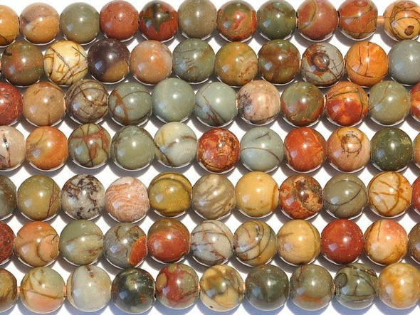Add earthy beauty to your designs with the Red Creek Jasper 8mm large-hole round beads from Dakota Stones. Available by the strand, these gemstone beads will amaze and delight with their innovative design. Each bead features a wide stringing hole, perfect for using with thicker stringing materials like leather cord. In fact, these beads are temporarily strung on leather cord. These perfectly round beads combine softly muted shades of mustard yellow, olive green and burnt red in patterns reminiscent of a picturesque sunset. Often the material of these beads is strengthened through stabilization. Red Creek Jasper is also known as Cherry Creek Jasper, multi-Picasso Jasper or red Picasso Jasper. Metaphysical Properties: Red Creek Jasper is believed by some to bring balance and relaxation. Like all Jaspers, it is a stone of protection and grounding.Because gemstones are natural materials, appearances may vary from bead to bead. Each strand includes approximately 24 beads.