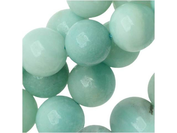 Airy style can be yours. These Dakota Stones gemstone beads display sky blue and turquoise tones you'll fall in love with. They are bold in size and perfectly round, so try them in bracelets and necklaces. Amazonite is also known as Amazon stone. Metaphysical Properties: Amazonite is said to balance energy, while promoting harmony and universal love. It is often called the stone of courage and the stone of truth, as it provides the ability to discover truths and integrity.Because gemstones are natural materials, appearances may vary from piece to piece. Each strand includes approximately 20 beads.