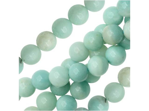 Airy style can be yours. These Dakota Stones gemstone beads display sky blue and turquoise tones you'll fall in love with. They are bold in size and perfectly round, so try them in bracelets and necklaces. Amazonite is also known as Amazon stone. Metaphysical Properties: Amazonite is said to balance energy, while promoting harmony and universal love. It is often called the stone of courage and the stone of truth, as it provides the ability to discover truths and integrity.Because gemstones are natural materials, appearances may vary from piece to piece. Each strand includes approximately 20 beads.