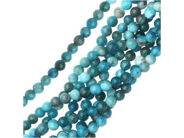 Capture the colors of the sea in your designs with the blue apatite 4mm round beads from Dakota Stones. Available by the strand, these small beads are perfectly round in shape and feature ocean colors ranging from deep blue to sea green. Use these beads as spacers in tropical, ocean-inspired looks. Blue apatite is a blue transparent phosphate material. It derives from the Greek word "apate," meaning to deceive, because it is often mistaken for other stones. The color of this material is such a vibrant blue that it is difficult to believe it could be found naturally. But this color is 100% natural. Mined in Brazil, Mexico, Myanmar, Africa and the USA, this stone has a Mohs hardness of 5. Metaphysical Properties: Often called a dual-action stone, blue apatite is used to achieve goals. It removes negativity, confusion and stimulates the mind to expand knowledge and truth. It is a great stone for encouraging inspiration and is famous for deepening meditation.Because gemstones are natural materials, appearances may vary from piece to piece. Each strand includes approximately 52 beads.