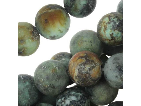 Stand out with gemstone style. These Dakota Stones beads are perfectly round in shape and would look great in matching necklace and bracelet sets. They feature turquoise color with a brown and black matrix. The matte finish adds a soft appearance. This stone is mined in Africa and is actually a type of spotted teal Jasper rather than turquoise. It is given its industry name because the matrix structure and shade is similar to that of turquoise. It has a Mohs hardness of 6. Metaphysical Properties: Often called the stone of evolution, African Turquoise Jasper encourages growth and development not only in the body, but in the mind. Some spiritualists believe that it will attract money to the wearer.Because gemstones are natural materials, appearances may vary from bead to bead. Each strand includes approximately 24 beads.