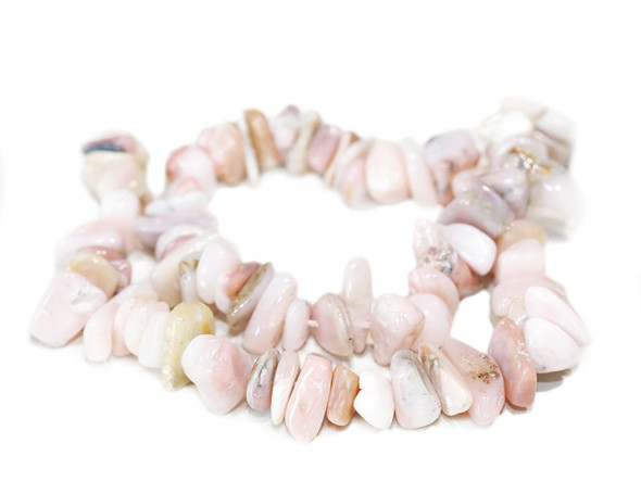 Bring soft color to your designs with these pink opal natural chip beads from Dakota Stones. Pink opal is a variety of non-precious opal, which means that it has luster and some translucency without the fire or color play associated with precious opal varieties. Pink Opal naturally occurs in shades of extremely pale to deeper pink. These beads feature irregular chip shapes, perfect for organic styles. Layer them into necklaces, bracelets, and even earrings. Because gemstones are natural materials, appearances may vary from piece to piece.