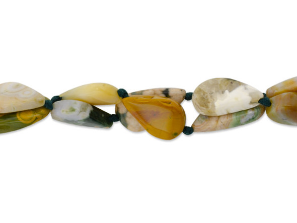 Bring beautiful earth tones into your designs with this Dakota Stones ocean jasper 16 x 12mm teardrop bead strand. These beads feature a teardrop shape and a mix of green, tan, white, and pink shades. Ocean Jasper is a commercial name for Orbicular Jasper, a variety of Jasper containing variably colored spherical patterns. Ocean Jasper is believed to be linked to the lost city of Atlantis and to hold mystic knowledge. Because gemstones are natural materials, appearances may vary from piece to piece. Size: 16 x 12mm, Hole Size: 0.8mm