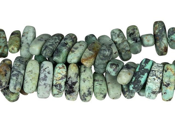 You'll love the organic style of these Dakota Stones beads. These beads feature a narrow oval chip shape. The stringing hole is drilled through the middle of the shape, so they are sure to stand out in designs. Layer them together for a modern look, or use a few as accents between smaller beads. They feature turquoise blue and green colors with a black matrix and a muted matte finish. This stone is mined in Africa and is actually a type of spotted teal Jasper rather than turquoise. It is given its industry name because the matrix structure and shade is similar to that of turquoise. Metaphysical Properties: Often called the stone of evolution, African Turquoise Jasper encourages growth and development not only in the body, but in the mind. Some spiritualists believe that it will attract money to the wearer.Because gemstones are natural materials, appearances may vary from piece to piece. Each strand includes approximately 34 beads.