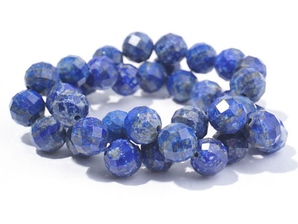 Bold style fills these Dakota Stones beads. These beads take on a classic round shape with beautiful facets that shine from every angle. You'll love the way they catch the eye in your projects. The dark blue color of these beads is lit up by flecks of gold glitter. Lapis lazuli is a semi-precious stone that contains primarily lazurite, calcite and pyrite. It was among the first gemstones to be worn as jewelry. Try pairing these beads with gold components. Metaphysical Properties: Lapis lazuli is said to enhance insight, intellect and awareness.Because gemstones are natural materials, appearances may vary from piece to piece.