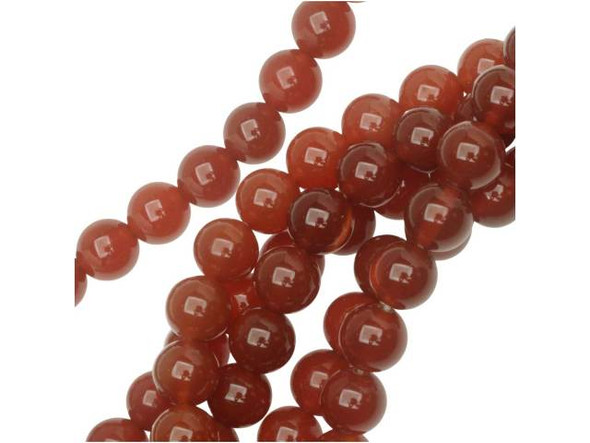 Make sure your design stay colorful with the Dakota Stones 8mm carnelian round beads. Available by the strand, these beads feature a versatile round shape. They are the perfect size for matching necklace and bracelet sets. Each bead displays a rich reddish-orange color. Carnelian is a translucent chalcedony or an A-grade agate that receives its beautiful red tints from iron oxides. Most deep red carnelian is heat treated to darken the material evenly. Carnelian is also known as the Mecca stone and natural agate. It has a Mohs hardness of 6.5. Metaphysical Properties: Often known as a motivation stone, carnelian is used for physical training and balancing body energy levels.Because gemstones are natural materials, appearances may vary from piece to piece. Carnelian is heat-treated to have a consistent color across the bead and strand. The color is very consistent. Each strand includes approximately 24 beads.Diameter 8-8.5mm