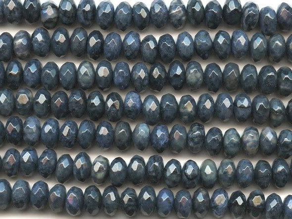 Create an elegant, shining look with the help of these dumortierite 8mm faceted rondelle beads from Dakota Stones. These beads feature a rounded shape and diamond-shaped facets cut into the surface to make them gleam from every angle. Each bead displays dark blue color full of depth. Dumortierite is a fibrous variably colored aluminum boro-silicate mineral. They crystals are vitreous and vary in color. Metaphysical Properties: Known as the "Stone of Order," dumortierite is said to help boost intellectual perception and to help in becoming more organized.Because gemstones are natural materials, appearances may vary from piece to piece. Each strand includes approximately 24 beads. 
