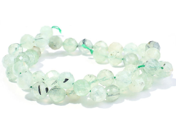 Bring a bit of green to your designs with these Dakota Stones gemstone beads. These prehnite beads have a round shape and feature facets that bring extra sparkle. They feature a pale green color. Prehnite is named after its discoverer, a Dutch colonel named Hendrik Von Prehn. It is a fairly strong crystal. Metaphysical Properties: Prehnite is believed to help with precognition and the gift of prophecy.Because gemstones are natural materials, appearances may vary from piece to piece.