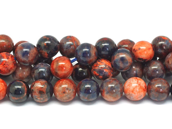 Add bold colors to your designs with this Dakota Stones dyed orange sodalite 10mm round bead strand. These beads feature a mix of bold blue and vibrant orange tones. They feature a classic round shape that is easy to add to your designs. Orange Sodalite has veins of orange, white and gray within the primarily bright to deep blue or black stone. Sodalite is named for its sodium content. Because gemstones are natural materials, appearances may vary from piece to piece.