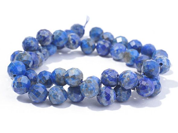 Bold style fills these Dakota Stones beads. These beads take on a classic round shape with beautiful facets that shine from every angle. You'll love the way they catch the eye in your projects. The dark blue color of these beads is lit up by flecks of gold glitter. Lapis lazuli is a semi-precious stone that contains primarily lazurite, calcite and pyrite. It was among the first gemstones to be worn as jewelry. Try pairing these beads with gold components. Metaphysical Properties: Lapis lazuli is said to enhance insight, intellect and awareness.Because gemstones are natural materials, appearances may vary from piece to piece.