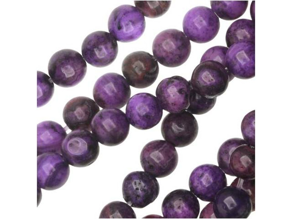 Warm drops of purple color will accent your designs when you use the purple crazy lace agate 4mm round beads from Dakota Stones. These small round beads would make excellent spacers in colorful designs. The purple color is swirled with burgundy and black. They have a Mohs hardness of 6.5-7. Mexican crazy lace agate is normally an opaque white gemstone with swirling patterns, but these beads are color enhanced to emphasize these beautiful patterns. Color enhancing is common amongst agates to make them fashionably relevant. Metaphysical Properties: Often called the happy stone, crazy lace agate promotes laughter and optimism. Because gemstones are natural materials, appearances may vary from bead to bead. Each strand includes approximately 52 beads.