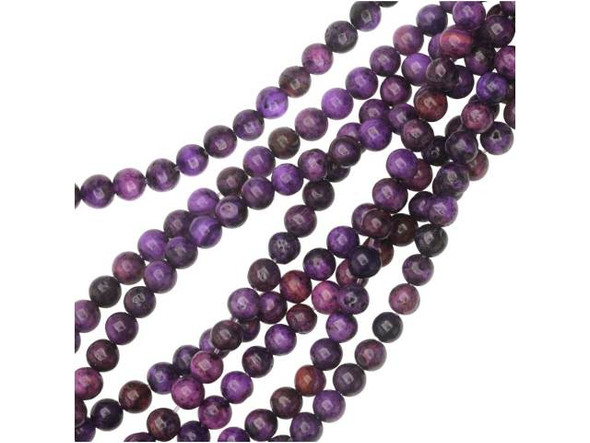 Warm drops of purple color will accent your designs when you use the purple crazy lace agate 4mm round beads from Dakota Stones. These small round beads would make excellent spacers in colorful designs. The purple color is swirled with burgundy and black. They have a Mohs hardness of 6.5-7. Mexican crazy lace agate is normally an opaque white gemstone with swirling patterns, but these beads are color enhanced to emphasize these beautiful patterns. Color enhancing is common amongst agates to make them fashionably relevant. Metaphysical Properties: Often called the happy stone, crazy lace agate promotes laughter and optimism. Because gemstones are natural materials, appearances may vary from bead to bead. Each strand includes approximately 52 beads.