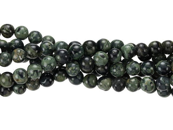 Captivating green and black tones swirl in these Dakota Stones gemstone beads. These beads feature a classic round shape you can add to any design. They are versatile in size, so add them to necklaces, bracelets and earrings. Kambaba jasper is mined exclusively in Africa and is also known as crocodile jasper due to its combination of dusky green base color and deep brown and black tapered oval rings. The swirling green color is caused by ancient fossilized algae, one of the oldest known forms of life on earth. Metaphysical Properties: Like all jaspers, this stone is metaphysically tied to grounding and protection. It's also said to enhance endurance, patience, and insight. Because gemstones are natural materials, appearances may vary from piece to piece. Each strand includes approximately 34 beads.