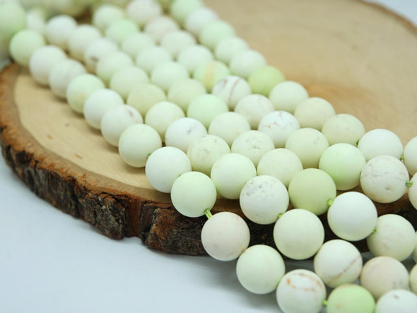 Be inspired by these 10mm round gemstone beads from Dakota Stones. These beads feature a classic round shape and a matte finish. Chrysoprase is a bright apple green, translucent stone, whose color often caused ancient jewelers to confuse it with Emerald. A cryptocrystalline Chalcedony, its brilliant color comes from the presence of very small inclusions of Nickel compounds. Chrysoprase is believed to balance the heart chakra and help one understand their needs and emotions. Because gemstones are natural materials, appearances may vary from bead to bead.