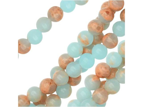 Soothing colors create a lovely display in these gemstone beads. These powder blue impression jasper beads from Dakota Stones feature a classic round shape that will work anywhere. They display a soft sky blue color interspersed with hints of peachy color. These beads will bring a dreamy, airy look to your designs. They are small in size, so you can use them as spacers or as pops of color in earring designs. Metaphysical properties: Jasper is said to be a stone of tranquility that will soothe nerves and banish negative thoughts.Because gemstones are natural materials, appearances may vary from piece to piece. Each strand includes approximately 52 beads.