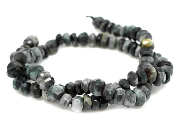 Decorate your jewelry designs with the gemstone style of these Dakota Stones beads. Similar to Tiger's Eye, this gemstone in its polished state looks like what it would be like to capture smoke in a stone -- bottomless black mixed with white wisps, with every gradient of gray in between. Shiny and sparkling at the same time. Because gemstones are natural materials, appearances may vary from bead to bead.