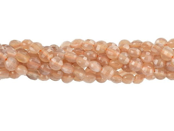 Enchanting style fills these Dakota Stones peach moonstone beads. These small gemstone beads feature a circular shape with a puffed edge and a checkerboard faceted face. The surface catches the light in a multitude of directions. The stringing hole is wide enough to use with 20 gauge wire. Use these small beads as accents of color and shine in all kinds of jewelry projects. They feature peachy pink colors with hints of glittering sheen. Metaphysical Properties: Moonstone is said to be a stone of love and is believed to aid in self-expression. Because gemstones are natural materials, appearances may vary from piece to piece. Each strand includes approximately 99 beads.