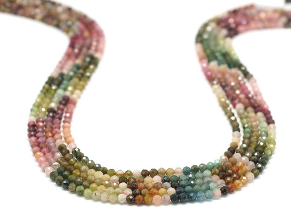 Add gemstone style to your designs with these faceted tourmaline gemstone beads from Dakota Stones. These beads feature a classic round shape with expertly cut facets that catch the light. These beads will add sparkle to any project. These tourmaline beads come in a range of colors from dark pink and forest green, to ivory, brown, and gray. Because gemstones are natural materials, appearances may vary from piece to piece.