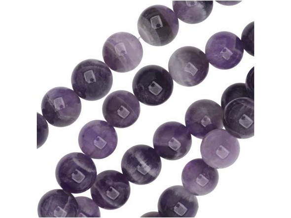 Decorate your designs with natural purple beauty. These beads feature cloudy purple colors mixed with swirling white color. These beads are perfectly round and large enough to stand out in any design. These beads would give necklaces and bracelets pops of pretty color. Mined in Africa, dog teeth amethyst is a combination of amethyst and white quartz mixed together in a striped, chevron pattern. It is named for its resemblance to the dog tooth violet. This stone is also known as chevron amethyst. Metaphysical Properties: Dog teeth amethyst is said to help remove resistance to change and to dissipate and repel negativity of all kinds.Because gemstones are natural materials, appearances may vary from bead to bead. Each strand includes approximately 20 beads. Our amethyst beads have nice, deep color, but may show natural inclusions.