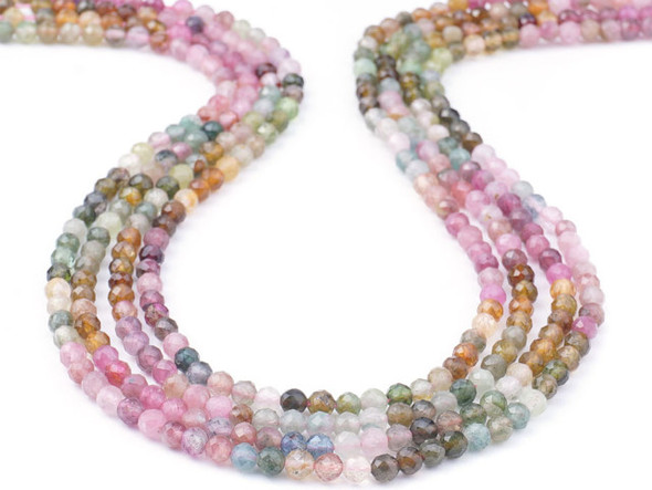 Add gemstone style to your designs with these faceted tourmaline gemstone beads from Dakota Stones. These beads feature a classic round shape with expertly cut facets that catch the light. These beads will add sparkle to any project. These tourmaline beads come in a range of colors from dark pink and forest green, to ivory, brown, and gray. Because gemstones are natural materials, appearances may vary from piece to piece.