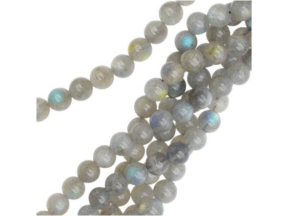 You'll love the magical look of these Dakota Stones gemstone beads. These round beads are versatile enough to use in necklaces, bracelets, and earrings. These beads are made from Labradorite and they feature smoky color that shines with a subtle fire filled with purple and blue tones. Labradorite is named for Labrador Island in Canada, where it was first discovered. Metaphysical Properties: Labradorite is said to detoxify the body and slow the aging process.Because gemstones are natural materials, appearances may vary from piece to piece. Each strand includes approximately 34 beads. 