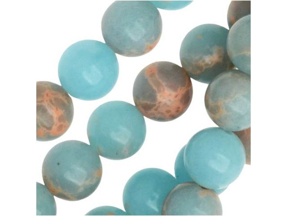 You'll love bringing soothing style to designs with these gemstone beads. These powder blue impression jasper beads from Dakota Stones feature a classic round shape that will work anywhere. They display a soft sky blue color interspersed with hints of peachy color. These beads will bring a dreamy, airy look to your designs. They are the perfect size for matching necklace and bracelet sets. Metaphysical properties: Jasper is said to be a stone of tranquility that will soothe nerves and banish negative thoughts.Because gemstones are natural materials, appearances may vary from piece to piece. Each strand includes approximately 24 beads.