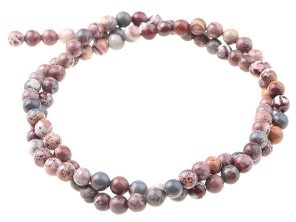 Bring gemstone style to your designs with these Sonora jasper beads from Dakota Stones. These beads feature a classic round shape. Sonora jasper is also known as Sonora dendritic. They get their name from where they are mined in Sonora, Mexico. These stones feature colors including shades of blue-gray, rust, gold, and rose along with deep maroon dendrites. Because gemstones are natural materials, appearances may vary from piece to piece.