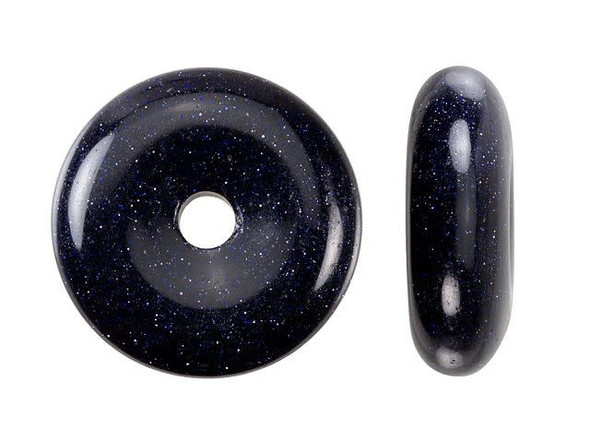 Glittering style can be yours with the Dakota Stones blue goldstone 25mm donut pendant. This gemstone pendant features a round donut shape with a hole at the center. You can create your own unique bail for this pendant or simply slide silk ribbon through. There are lots of fun ways you can showcase this piece in your designs. It features dark blue color that glitters like stars in the sky. Goldstone is glass with flecks of copper suspended in it. It has been around since the European Renaissance and stories say it was discovered accidentally by Venetian monks. Metaphysical Properties: Known as the stone of ambition, blue goldstone is often used in healing and when dealing with hypersensitivity.Because gemstones are natural materials, appearances may vary from piece to piece.Diameter 25mm, Opening Diameter 4mm