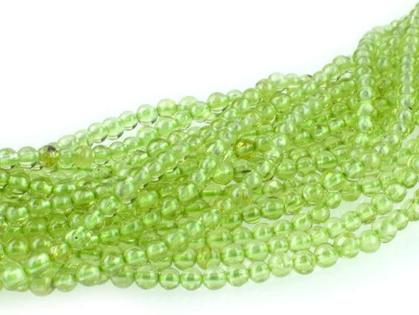 Put pops of cheerful color into your designs with the Dakota Stones 2mm peridot round beads. Available by the strand, these gemstone beads feature a perfectly round shape. They are tiny in size, so you can use them as small accents of color in earrings or a bracelet. They would work well in bead embroidery and with seed beads. Peridot is the birthstone for the month of August. These beads feature a bright and cheerful green color.Because gemstones are natural materials, appearances may vary from piece to piece. Each strand includes approximately 194 beads.