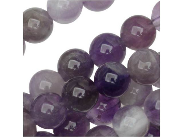 The natural color of these dog teeth amethyst 6mm round beads from Dakota Stones will create regal style in your designs. These beads feature a round shape for a classic look you can add to necklaces, bracelets and even earrings. The versatile size means these beads work anywhere. These beads feature a swirl of purple and white color. Mined in Africa, dog teeth amethyst is a combination of amethyst and white quartz mixed together in a striped, chevron pattern. It is named for its resemblance to the dog tooth violet. This stone is also known as chevron amethyst. Metaphysical Properties: Dog teeth amethyst is said to help remove resistance to change and to dissipate and repel negativity of all kinds.Because gemstones are natural materials, appearances may vary from piece to piece. Each strand includes approximately 34 beads. Our amethyst beads have nice, deep color, but may show natural inclusions.