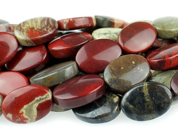 Colorful elegance fills the Dakota Stones 10x14mm Apple Jasper oval beads. These beads feature a flat oval shape full of classic style. They are bold enough to stand out in long necklace strands or even bracelet designs. These beads feature the rich and juicy colors of fresh apples hanging from a tree. Deep red mingles with hints of leafy green and bark brown. Pair them with earthy colors for a pleasing display. Jasper is an opaque variety of quartz, with a microscopic crystalline structure. Metaphysical Properties: Jasper is thought to improve vision and protect from unseen dangers at night.Because gemstones are natural materials, appearances may vary from piece to piece. Each strand includes approximately 14 beads.
