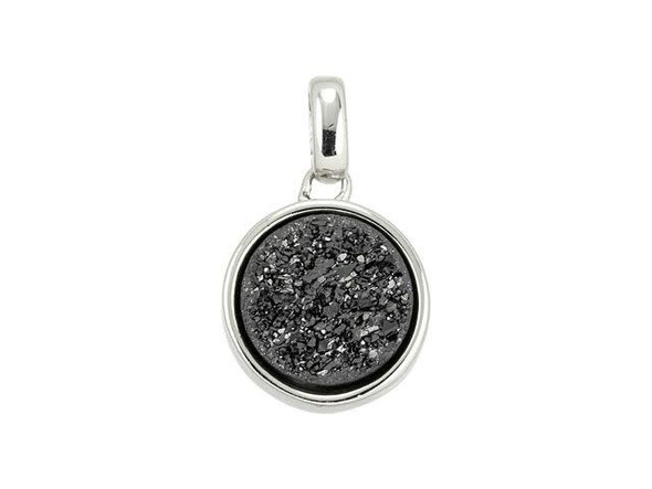 Decorate designs with the glittering beauty of this Dakota Stones druzy charm. This charm features a circular bezel that holds a sparking druzy in place. Druzy is a coating of fine crystals on a rock fracture surface, vein or within a geode. A titanium treatment creates a beautiful metallic effect on the rough surface of the druzy. An oval-shaped bail is attached to the loop at the top of the charm, so it's easy to slide into designs. Showcase it in charm bracelets, necklaces, and even earrings. The druzy features a bold black gleam, while the bezel features a versatile silver shine. Because gemstones are natural materials, appearances may vary from piece to piece.Gemstone Diameter 10mm