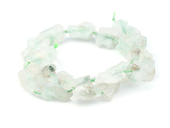 Bring the organic beauty of gemstones to your designs with the Dakota Stones 10 x 18mm fuschite in quartz rough nugget beads. Available by the strand, these gemstone beads take on jagged, rock-like shapes. The cloudy-white quartz is decorated with patches of green and brown fuschite. Add them to necklaces, bracelets and earrings and brighten up your style. This stone is also known as Rock Quartz and represents creativity. Because gemstones are natural materials, appearances may vary from bead to bead.