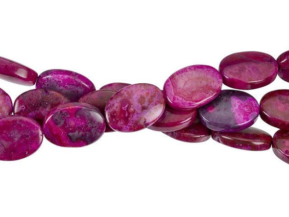 Get playful in your style with these Dakota Stones beads. They feature a fun oval shape and deep pink color full of swirls. They are a great option for long necklace strands, bracelets, and even earrings. Mexican crazy lace agate is normally an opaque white gemstone with swirling patterns, but these beads are color enhanced with pink coloring to emphasize these beautiful patterns. Color enhancing is common amongst agates to make them fashionably relevant. They have a Mohs hardness of 6.5-7. Metaphysical Properties: Often called the happy stone, crazy lace agate promotes laughter and optimism. Because gemstones are natural materials, appearances may vary from bead to bead. Each strand includes approximately 14 beads. 