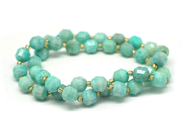 Energize your designs with this Dakota Stones Brazilian amazonite faceted 8mm energy prism bead strand. The beads on this strand feature a faceted cut helping them catch the light. This strand features spacers between each of the beads, so you could use it as-is, or string the beads into a design. Brazilian Amazonite is an opaque blue to green to light green stone, often occurring with inclusions of white, yellow or gray and occasionally translucent milky white. It is named for the Amazon River in Brazil, where the stones are thought to have been originally found, however they are not currently sourced from that particular region. Amazonite has a long and illustrious history dating back to Mesopotamia. It was used in the Egyptian Book of the Dead, and an Amazonite ring was found among the treasures in King Tutankhamun's tomb. Because gemstones are natural materials, appearances may vary from bead to bead.