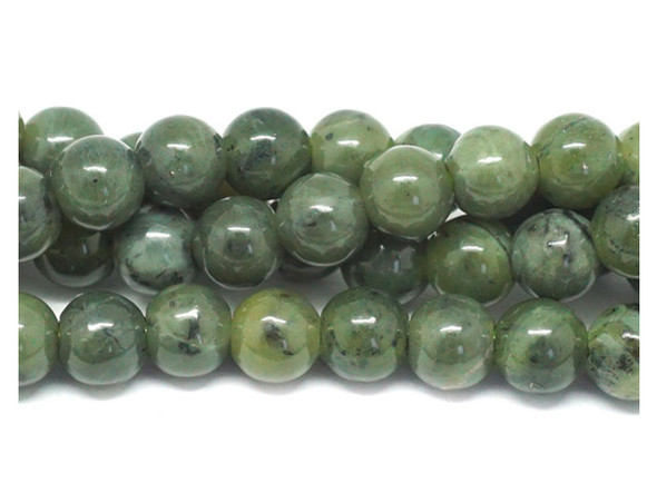 Let gorgeous green color fill your designs. These Dakota Stones beads feature mossy green color with flecks of black in the matrix, for an earthy look you won't want to pass up. These round beads also feature a faceted surface, for an eye-catching gleam. Use these versatile gemstone beads in necklaces, bracelets, and earrings. They feature wide stringing holes, so you can use them with thicker stringing materials, like leather. Because gemstones are natural materials, appearances may vary from bead to bead. 