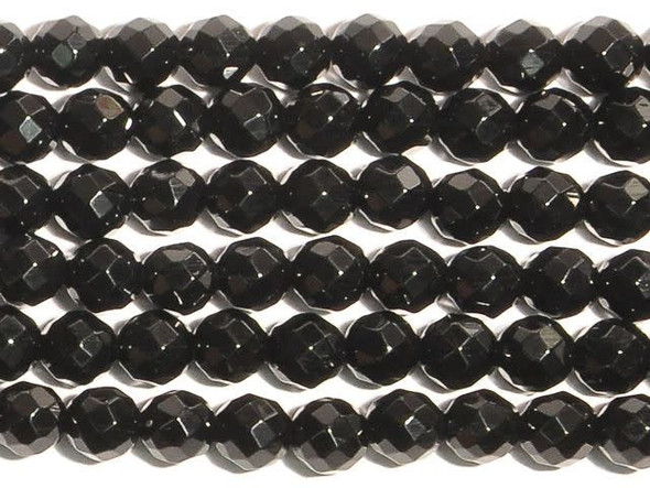 Mix it up in your designs with the unique onyx 6mm faceted round beads from Dakota Stones. Available by the strand, these small round beads feature facets cut into the surface for fun dimension and added shine. These beads feature a versatile size that can be used in necklaces, bracelets and even earrings. Onyx is a variety of chalcedony that is similar to agate, with straight rather than curved bands. It has a Mohs hardness of 6-7. Metaphysical Properties: Often known as a protection stone, onyx absorbs and dissolves negative energy from the body.Because gemstones are natural materials, appearances may vary from bead to bead. All Onyx beads are heat-treated. Dakota Stones cuts its Onyx from rough material that is heated at least 3 times to make sure the black color is consistent and any light lines are not visible. Each strand includes approximately 34 beads.